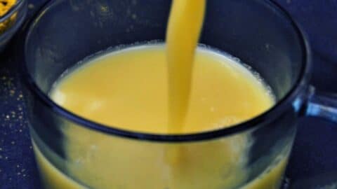 pouring kashayam into the glass.