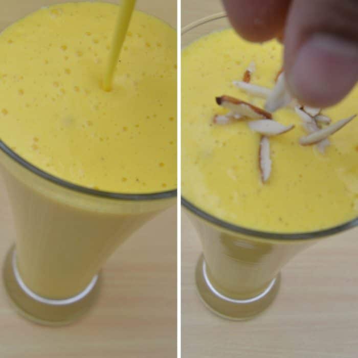 pouring mango lassi in a glass and adding few almond slices