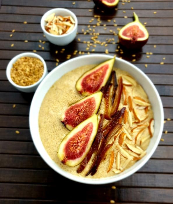 flaxseed porridge with figs and almonds in a white bowl