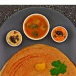 pin image of millet dosa with black text overlay on top.