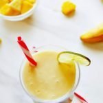 pin image of pineapple banana mango smoothie with red text overlay on the top.