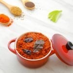 green mango chutney in red bowl