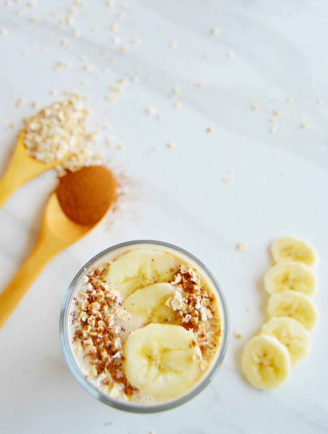 banana oatmeal smoothie in a glass.