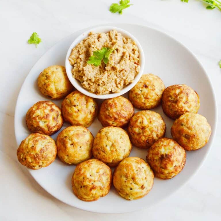 close up shot of rava appe in a plate.
