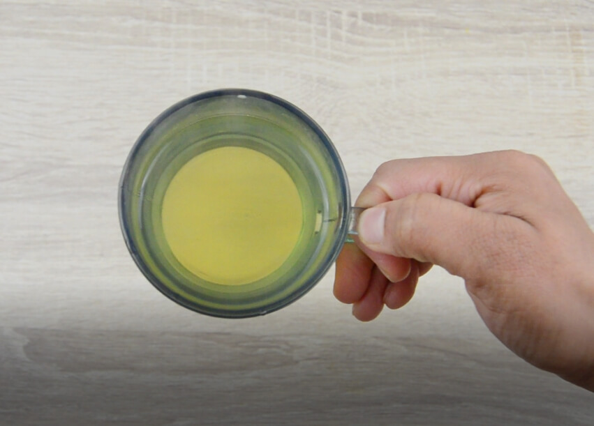 holding a cup of fresh mint tea.