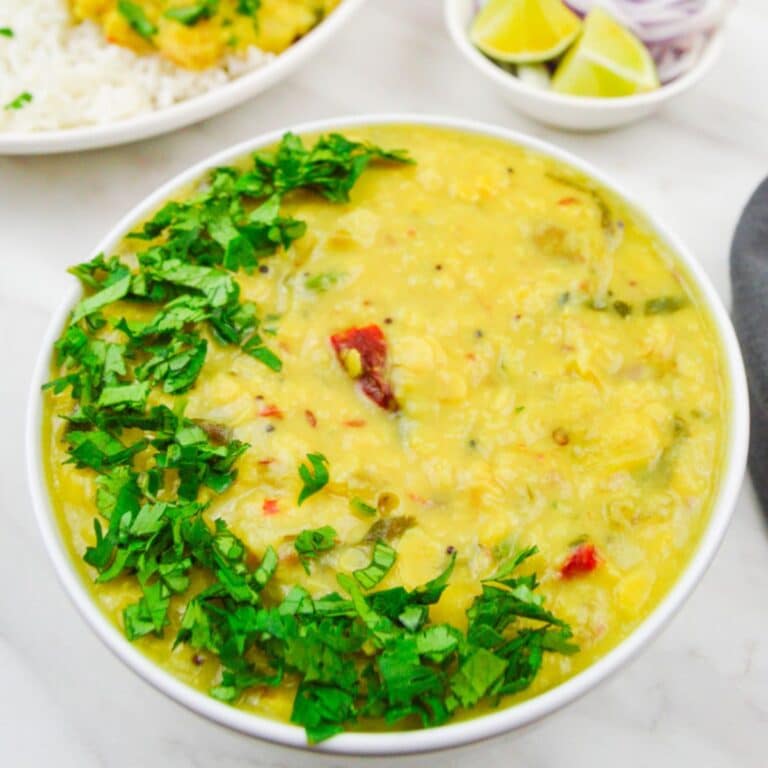 mango dal in a white bowl on a marble.