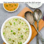 white bowl of peas pulao placed on wooden board on a granite with a bowl of curry sauce, yogurt and 2 spoons and a slice of lime with text overlay on top.