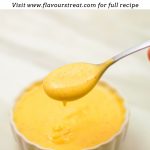 pinterest image showing a white bowl of yellow sauce with a sauce filled spoon with black text overlay on top.