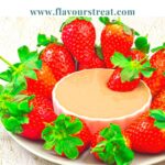 Pin image of strawberry platter with a white bowl of chocolate dip in the middle placed in the middle with blue text overlay on top.