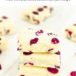 pin image of white chocolate cranberry fudge with black text overlay on top.