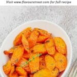 pin image of maple roasted carrots with a black text overlay on the top.