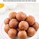 pin image of no bake peanut butter balls placed on the plate with text overlay on top.