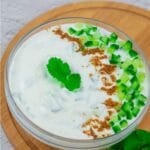pin image of Indian cucumber yogurt dip with text overlay on top and bottom.