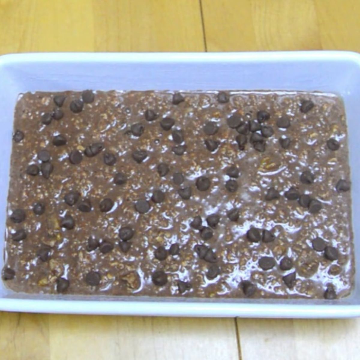 chocolate oats with chocolate chips in a baking tray.