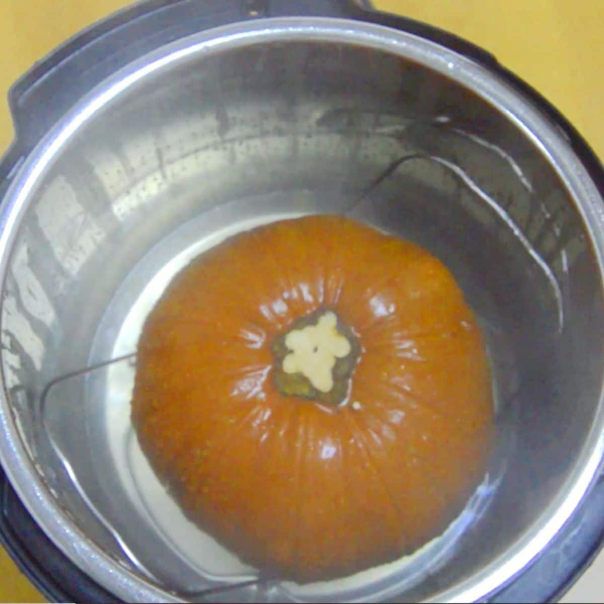 cooked whole pumpkin inside instant pot.
