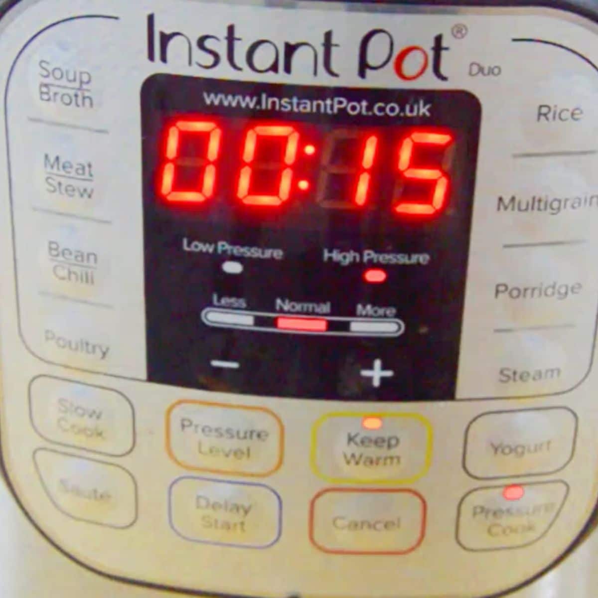 timer of instant pot displaying 15 minutes at high pressure in pressure cook mode. 
