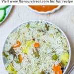 pin image of instant pot veg pulao in a white bowl with a text overlay on top.