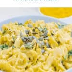 pin image of pumpkin pasta with blue text overlay on top.