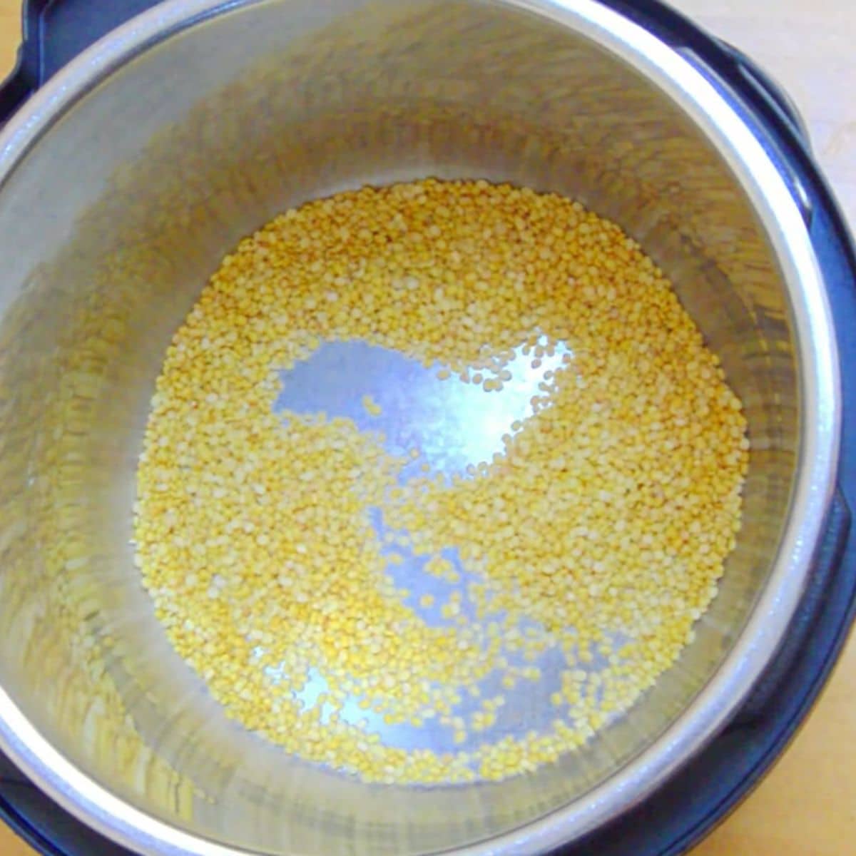 moong dal in the inner steel pot of instant pot.