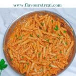 pin image of pink sauce pasta with blue text overlay on the top.