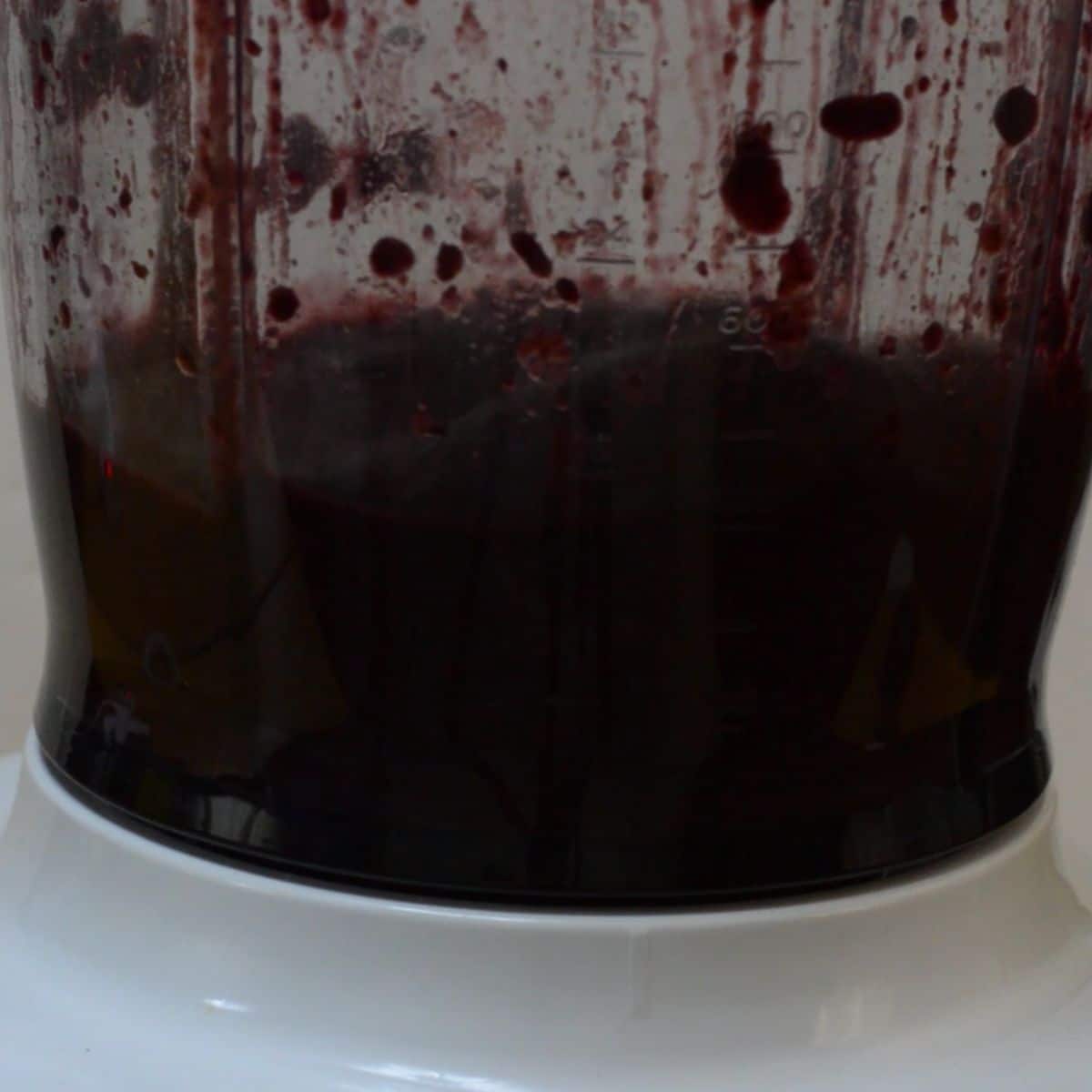 blending blueberry coulis in the blender jar.