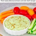 pin image of avocado yogurt dip with black text overlay on the top.