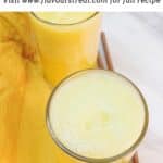 pin image of pineapple ginger juice with black text overlay on the top.