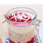 pin image of raspberry overnight oats with blue text overlay on the top.