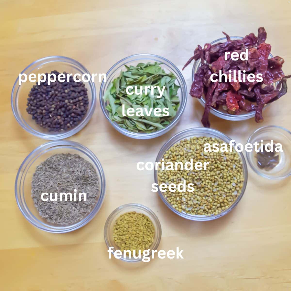 whole spices placed on a wooden table.