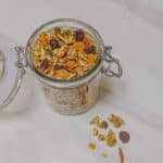 top view of granola in a glass jar.