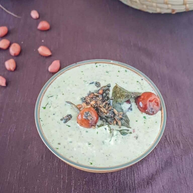 peanut coconut chutney with tadka on the top placed on a cloth.