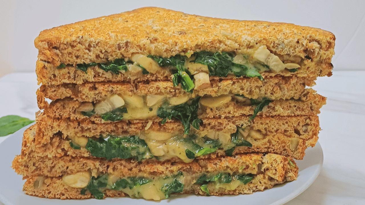 closeup shot of mushroom spinach sandwich.