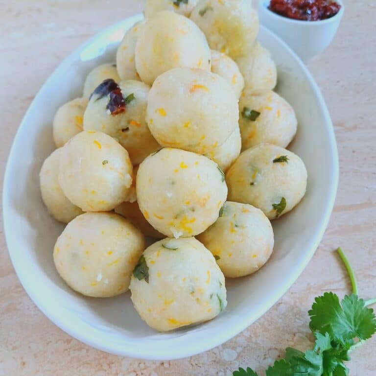 steamed rice balls in a white plate.