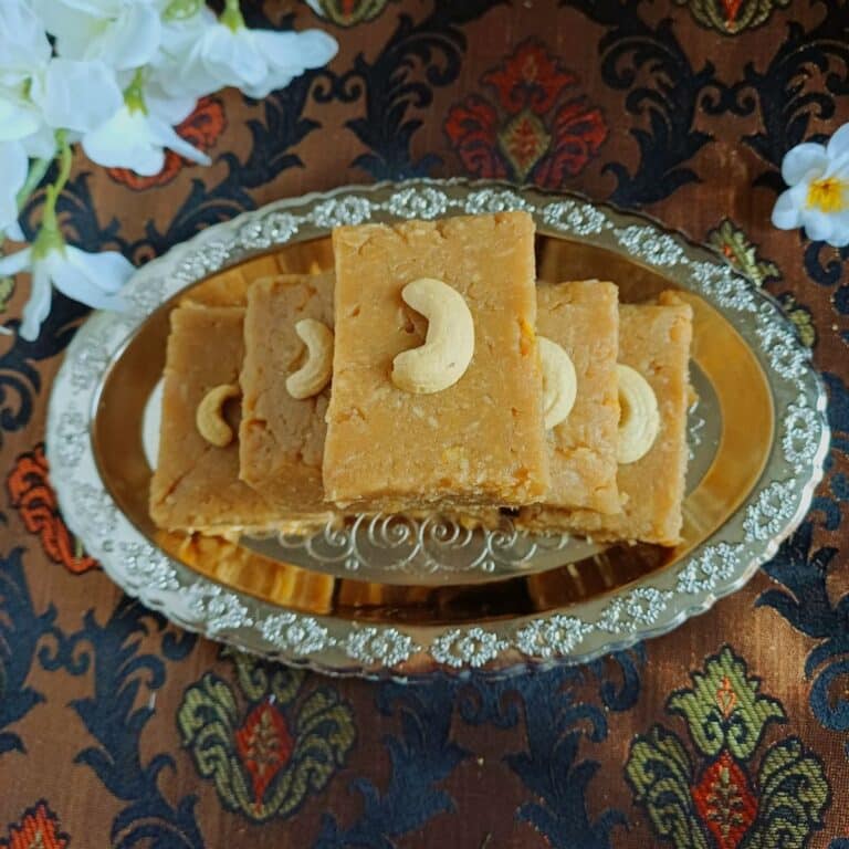 rice chana dal jaggery halwa arranged in a silver plate.