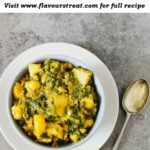 pin image of aloo palak with text overlay on the top.