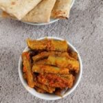 pin image of spicy stir fried eggplant with text overlay on the top.