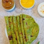 pin image of spinach chapati with text overlay on the top.