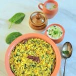 pin image of palak dal khichdi with text overlay on the top.