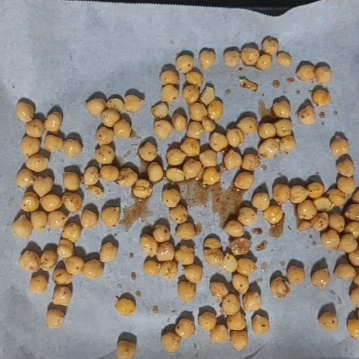 marinated chickpeas on lined baking sheet.