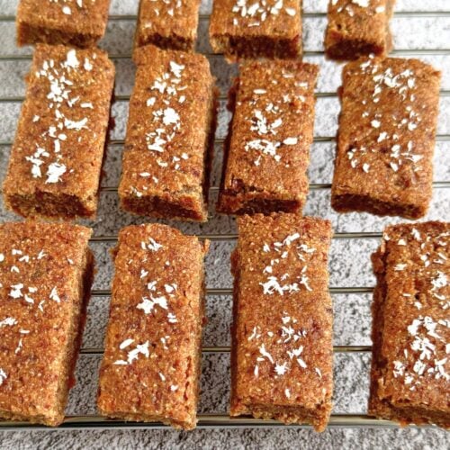 kid friendly carrot oatmeal breakfast bars arranged on wire rack.