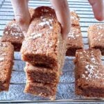 child picking up 4 ingredient carrot oatmeal breakfast bar from a stack.