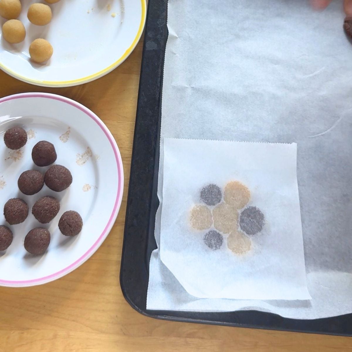 process of making two toned glutenfree almond cookie on lined baking tray.