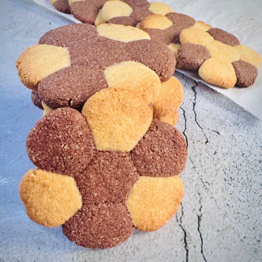 almond flour vanilla chocolate cookie placed on light coloured surface.