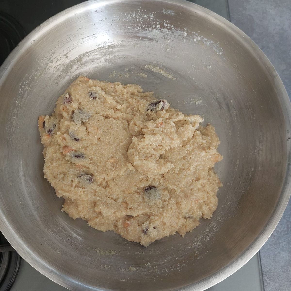 rava laddu mixture in a wide steel pan.