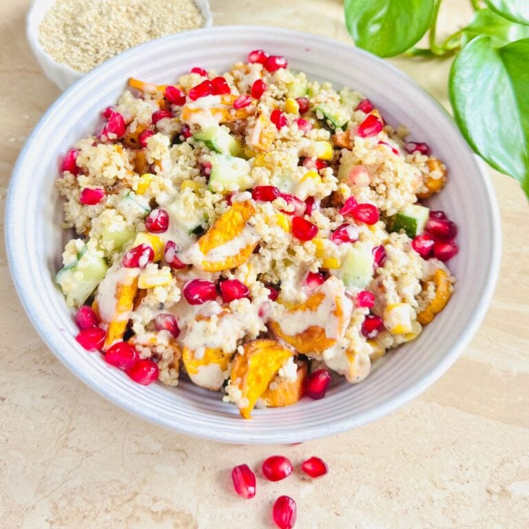 close up image of roasted sweet potato quinoa salad with tahini lemon dressing.
